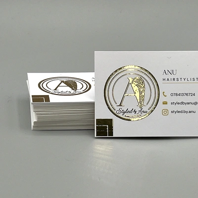 Gold foil blocked business cards featuring a premium metallic finish for a luxury, high-end appearance.
