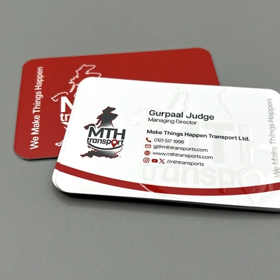 Spot UV rounded corner business cards with selective gloss coating to highlight logos and key design elements.