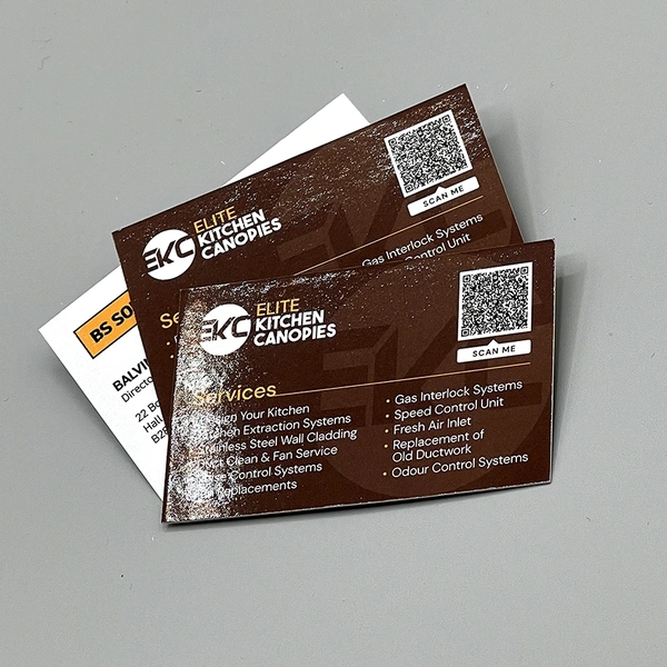 Gloss laminated business cards printed on premium card stock with a smooth, high-shine finish.