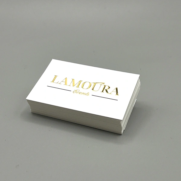 Gold foil blocked business cards featuring a premium metallic finish for a luxury, high-end appearance.