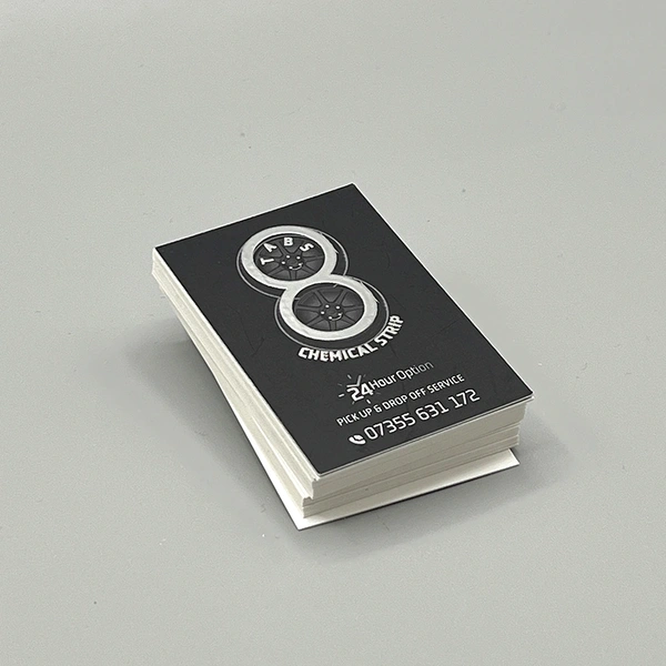 Silver foil blocked business cards featuring a premium metallic finish for a luxury, high-end appearance.