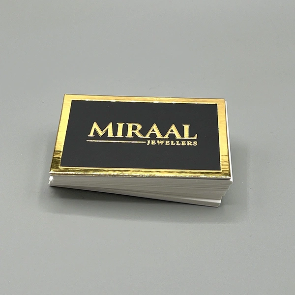 Gold foil blocked business cards featuring a premium metallic finish for a luxury, high-end appearance.
