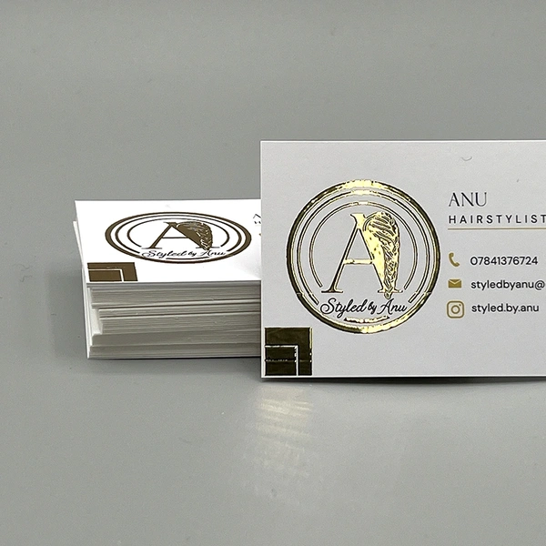Gold foil blocked business cards featuring a premium metallic finish for a luxury, high-end appearance.