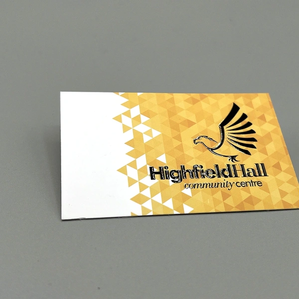 Spot UV business cards with selective gloss coating to highlight logos and key design elements.